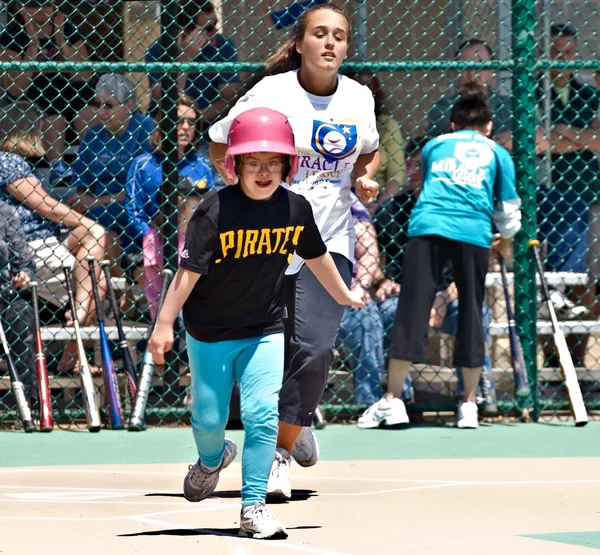 Young Batter Running to First Base — Stock Photo, Image