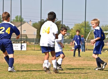 Young Boys Soccer Spotting the Ball clipart