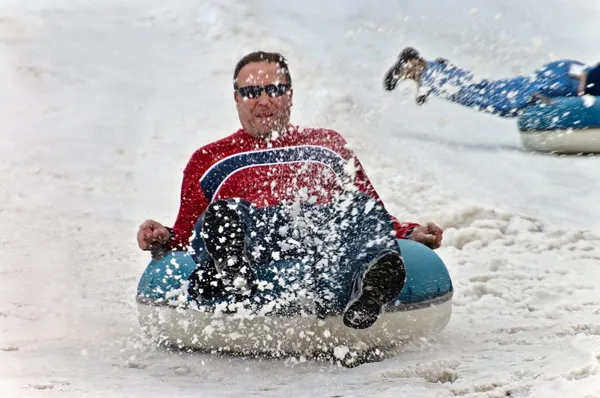 Man Tubing in Snow — Stock Photo, Image