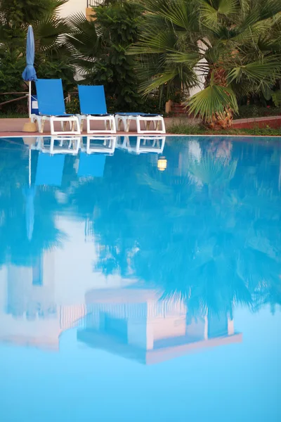 Chairs by the pool — Stock Photo, Image