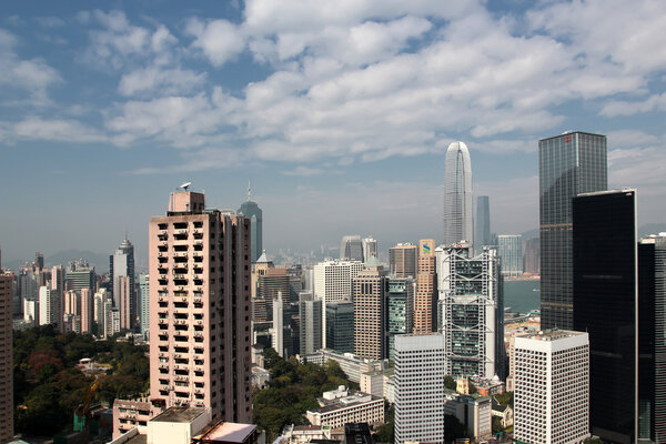 View at modern skyscrapers in downtown Hong Kong. Hong Kong is an international financial centre that has 112 buildings that stand taller than 180 metres