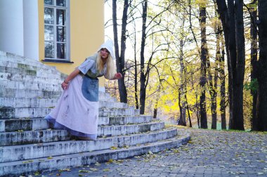 Girl actress plays the role of Cinderella's fairy tale about the old m clipart