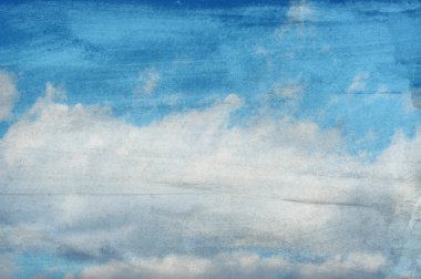 Clouds on a textured paper background clipart