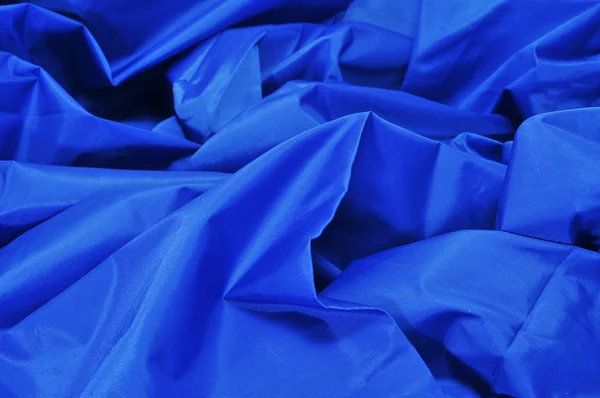 Blauw satijnen stof — Stockfoto
