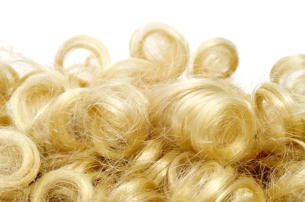 Curly blonde wig Stock Image