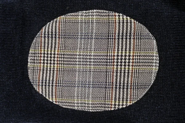 Patch tissu dans un tissu tricoté — Photo