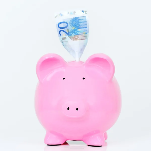 Pink piggy bank with bill — Stock Photo, Image