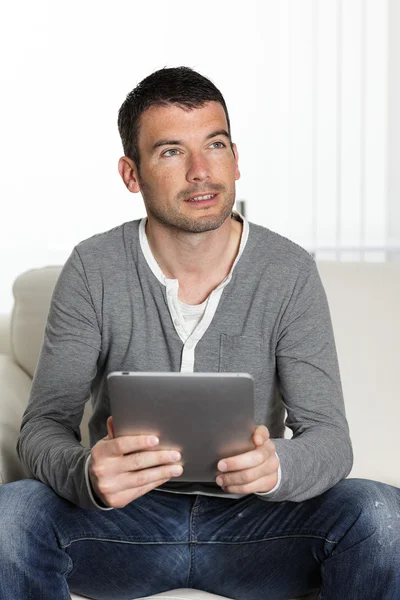 On sofa with tablet — Stock Photo, Image