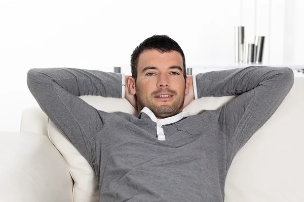 Relaxed man on sofa — Stock Photo, Image
