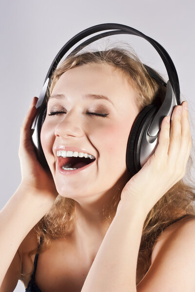 Pretty woman listening, and enjoying music