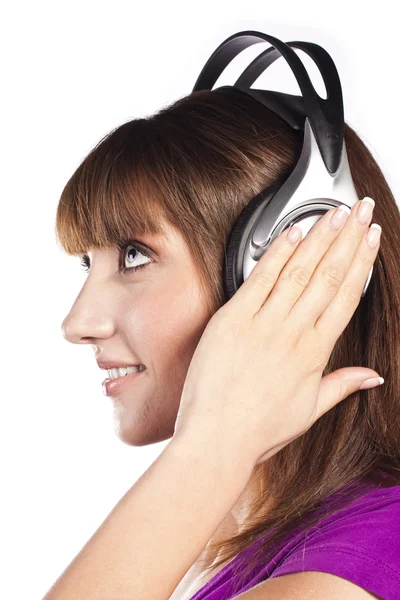 Flot kvinde lytter, og nyder musik - Stock-foto