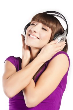 Pretty young woman listening music clipart