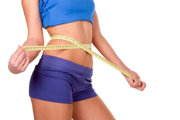 Measure tape around slim beautiful waist — Stock Photo, Image