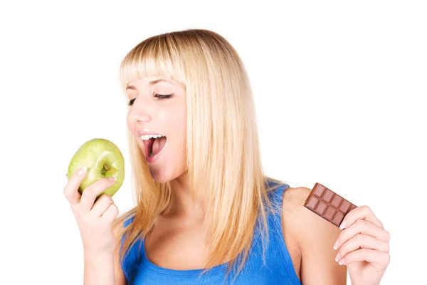 Blonde with apple and chocolates — Stock Photo, Image