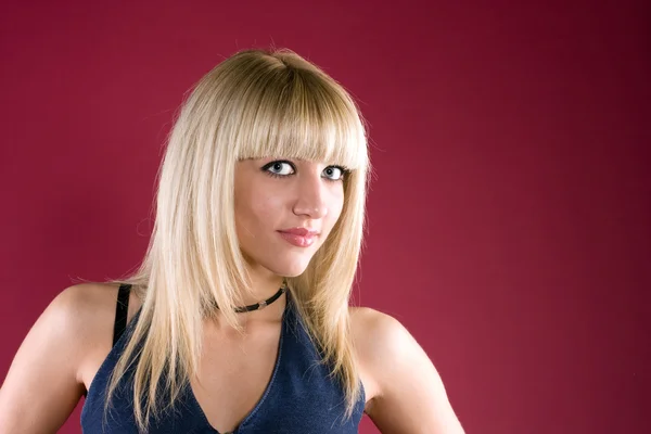 Bilden av vänliga blond över röd bakgrund — Stockfoto