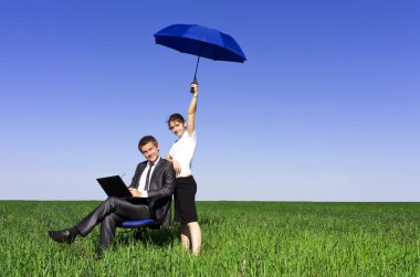 The insurance agent in the field, giving you the best protection clipart