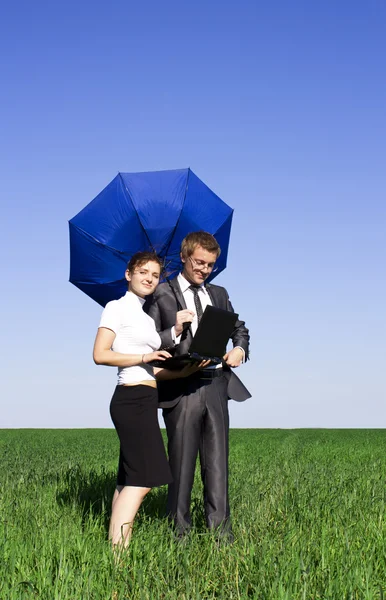 An insurance agent ready to protect you with his umbrella — Stock Photo, Image