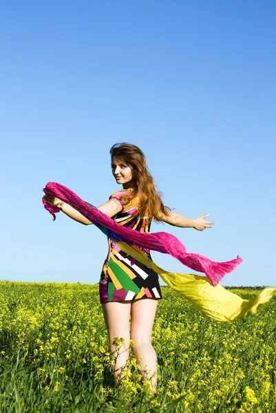 stock image Girl on a yellow field with handkerchiefs in their hands