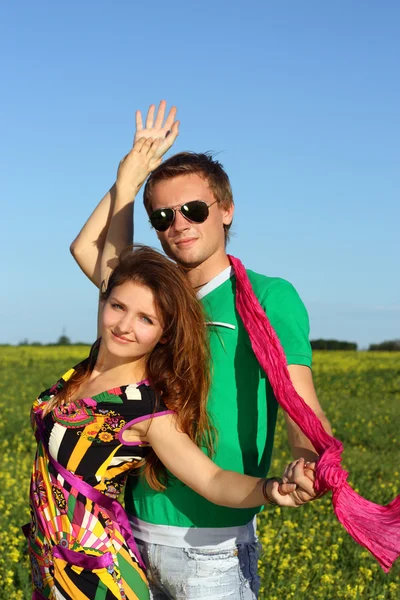 Young beautiful happy couple on the field. street — Stock Photo, Image