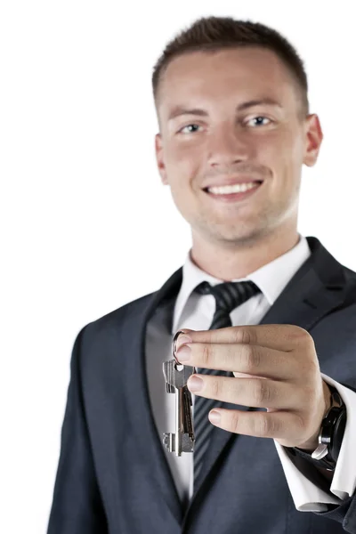 Business man giving you the keys to a home — Stock Photo, Image
