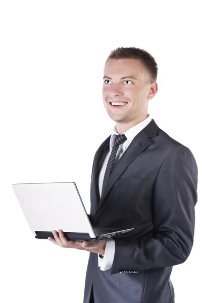 Un uomo d'affari che lavora con un portatile. Su sfondo bianco — Foto Stock