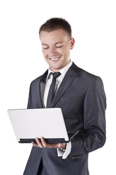 Empresário com laptop aberto em suas mãos, sorria — Fotografia de Stock