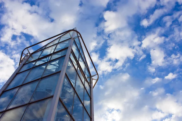 Modern office house. blue glass on a background sky — Stock Photo, Image