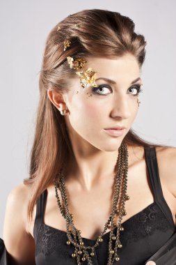 Young brunette lady with luxury accessories