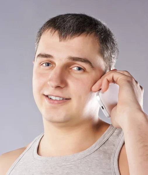 Handsome man portrait talking at the cell phone — Stock Photo, Image