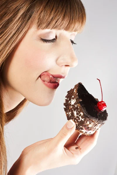 Beautiful brunette woman with a cake Stock Picture