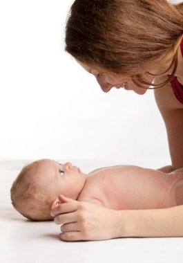 Young caucasian woman and her two-month old son clipart