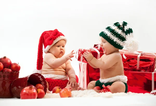 Two cute babies in Christmas costumes — Stock Photo, Image