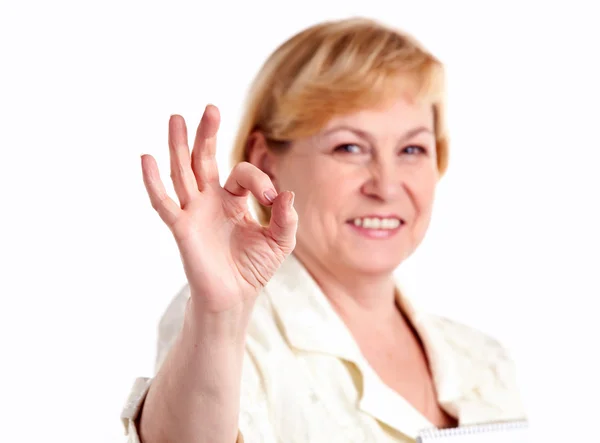 Cheerful mature woman showing the ok sign — Stock Photo, Image