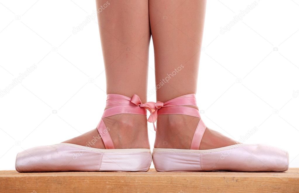 Cropped view of ballerina's feet in pointes