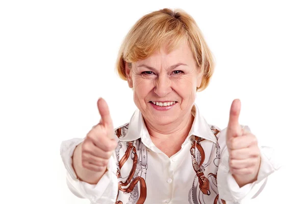Щаслива зріла жінка показує великі пальці вгору знак — стокове фото