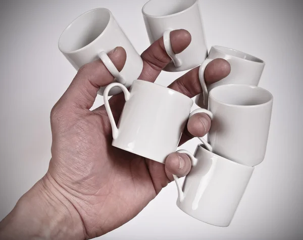 Coffee cups in hand — Stock Photo, Image