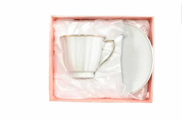 Białe filiżanka i spodek w pudełko różowy — Zdjęcie stockowe