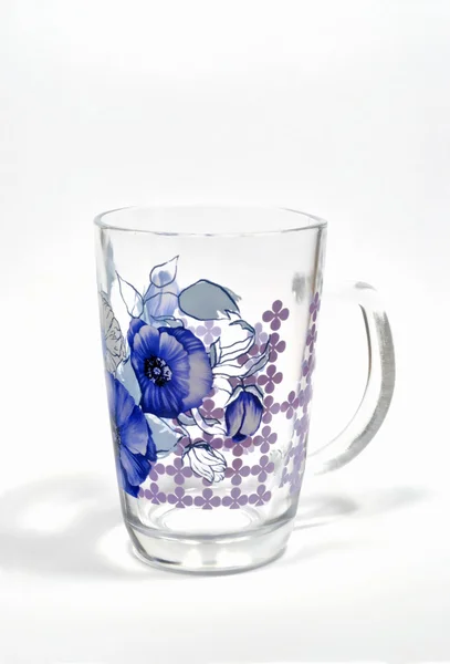 The glass cup with painted blue flowers — Stock Photo, Image