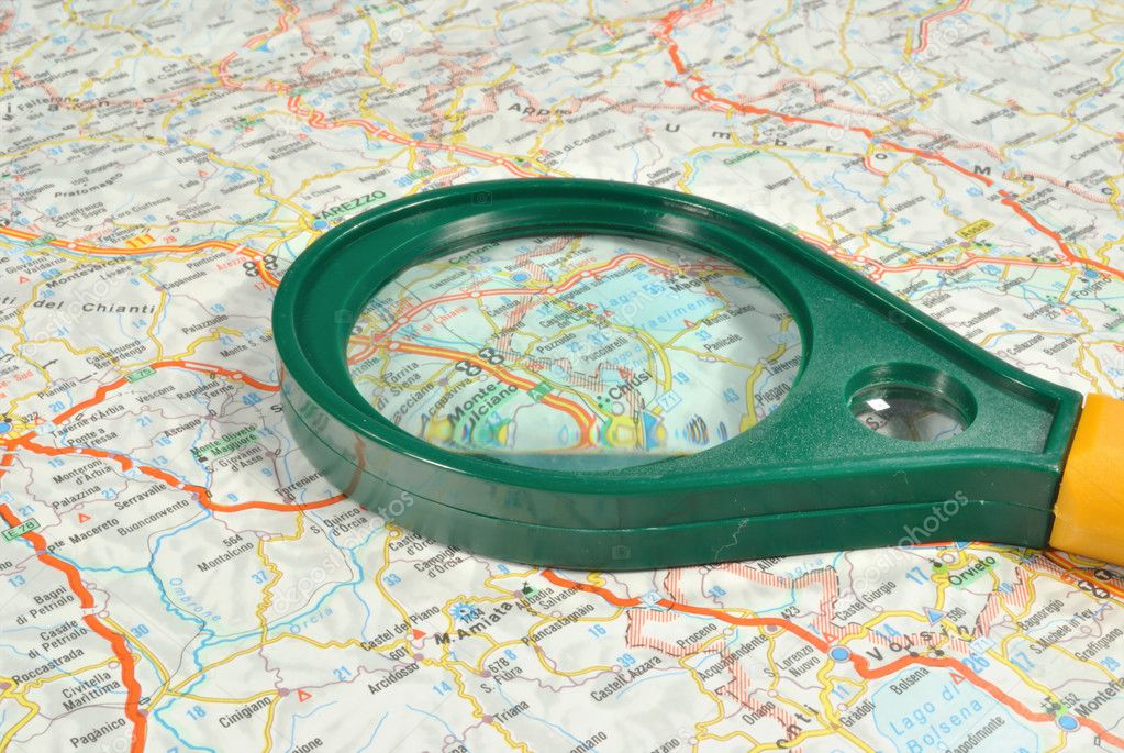 The touristic map and magnifying glass