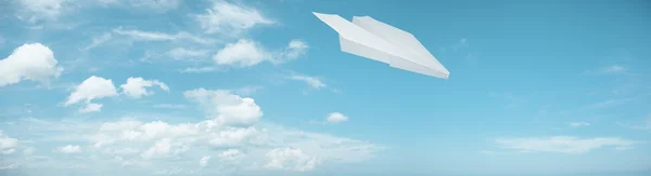 Paper plane in flight