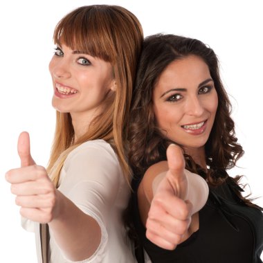 Two happy young women with thimbs up clipart