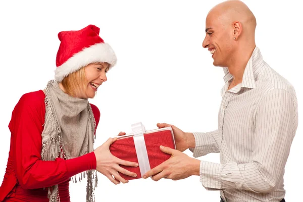 Christmas gift - Girl in santa dress giving a gift to a man — Stock Photo, Image