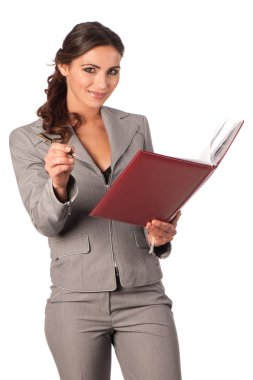 Young cute business woman with a book in her hands clipart