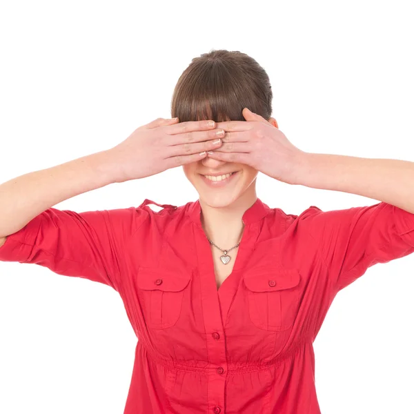 Young woman covering her eyes with her hands. Studio shot agains — Stock Photo, Image
