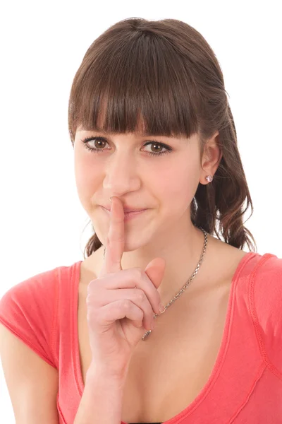 Sedni si. tajemství - mladá dívka s prstem přes ústa — Stock fotografie