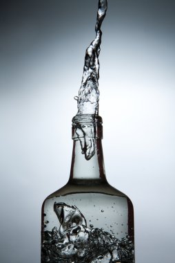 A stream of alcohol from a bottle.