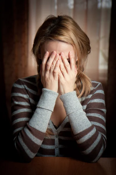 stock image Ayoung woman took her hands face