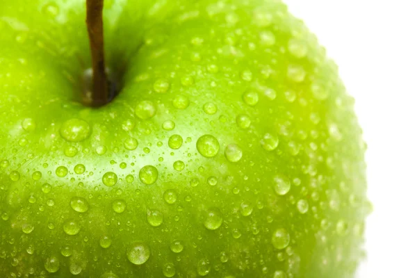 stock image Green apple with water drops close up
