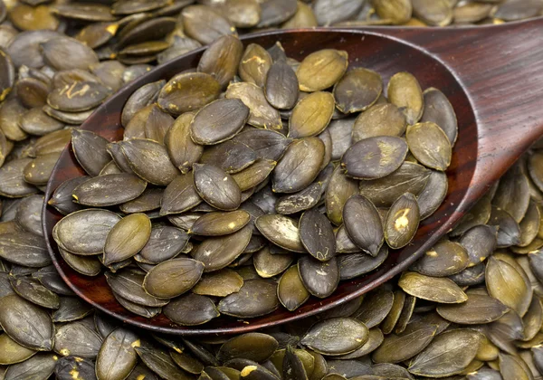 stock image Pumpkin seed in a wooden spoon