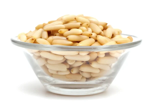 Pine nuts on a glass bowl — Stock Photo, Image